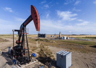 An oil pump in operation, efficiently drawing oil from the earth, highlighting the energy sector's machinery.